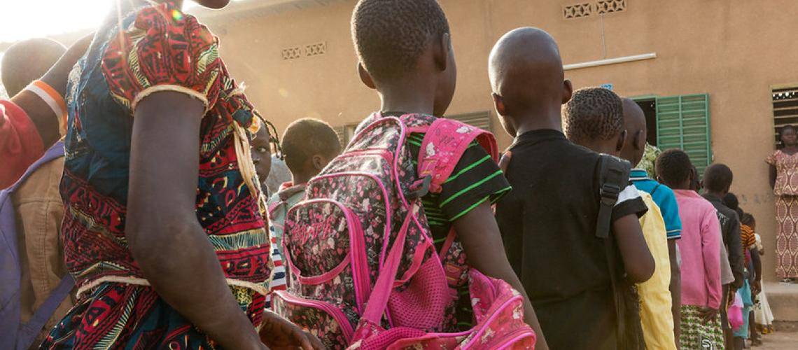 Class two students line up to enter the classroom at the start of school, Sandogo “B” primary school, District 7, Ouagadougou.