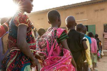 Class two students line up to enter the classroom at the start of school, Sandogo “B” primary school, District 7, Ouagadougou.