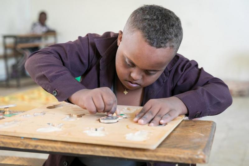 Fasil, 11, works a puzzle at the Felege Abay Elementary School, Bahar Dar, Ethiopia.